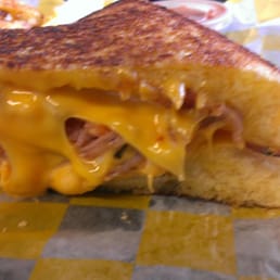 The Classic
Cheddar cheese, American cheese, tomatoes, ham and bacon on Texas toast.