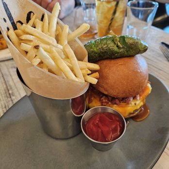 Tribe at Riverwalk - Hawaiian jerk burger was soooo good. The pork belly crumbles and pineapple, set it off. - New American Near Me - Castle Rock, Colorado