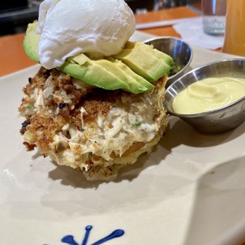 Snooze, an A.M. Eatery - Crab cake Benedict with sauce on the side - Breakfast & Brunch Near Me - Tucson, Arizona