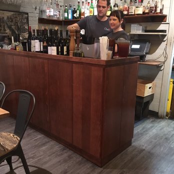 Cheers In the Heights - a man and a woman behind a bar - American Near Me - Little Rock, Arkansas