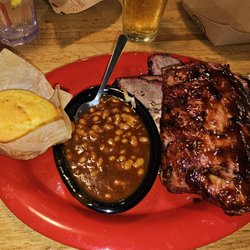 Sonny's BBQ - 4 meat plate. Ribs, pulled pork, and double the brisket