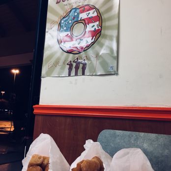 Oceanside Donut - three donuts wrapped in paper on a table - Donuts Near Me - Oceanside, California