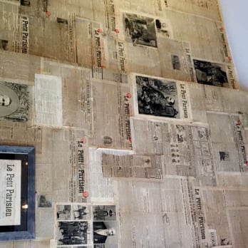 Le Petit Parisien - Wall covered in French newspaper - Sandwiches Near Me - New York, New York