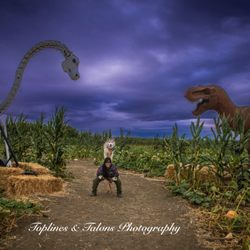 Cool Patch Pumpkins - Our classic piggyback pose in front of the Dino statues