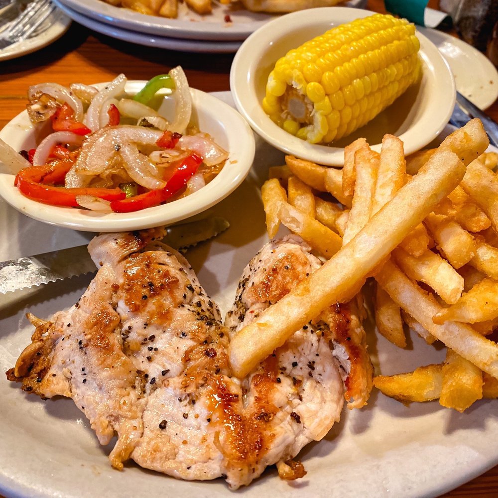 Neal's Dining Room - a plate of chicken, french fries, and corn on the cob - American Near Me - Concan, Texas