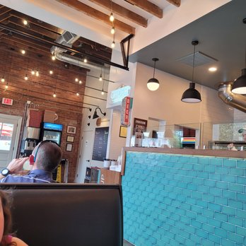 Pizzoco Pizza Parlor - a man taking a picture - Pizza Near Me - Winchester, Virginia