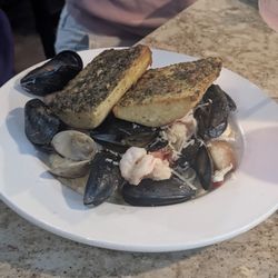Neptune's Seafood Pub - Seafood Neptune (clams, mussels, crab, shrimp and scallops over linguine pasta with a cheese sauce)