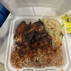 Blues Jamaican Restaurant - Jerk Chicken Quarter, cabbage, Rice and Peas