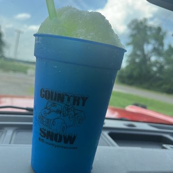 Country Snow - a blue cup with a green straw - Desserts Near Me - Edmond, Oklahoma Country Snow - a blue cup with a green straw - Desserts Near Me - Edmond, Oklahoma