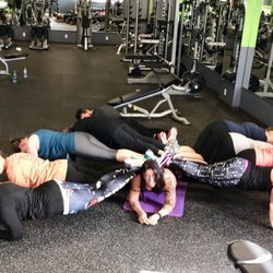 Freebs Fitness &Tanning - The owner doing planks with the class.