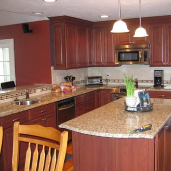 Dolan Remodeling - a kitchen with granite countertops - General Contractors Near Me - Blackstone, Massachusetts