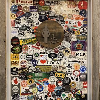 Star Cider - a door covered in stickers - Cideries Near Me - Canandaigua, New York