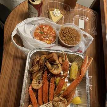 Curry In A Hurry - a tray of crab legs, corn, beans, and corn on the cob - Food Trucks Near Me - Fort Walton Beach, Florida Curry In A Hurry - a tray of crab legs, corn, beans, and corn on the cob - Food Trucks Near Me - Fort Walton Beach, Florida