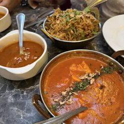Khan Spices Indian Restaurant - Chicken biryani, sauce and in the foreground the butter paneer dish