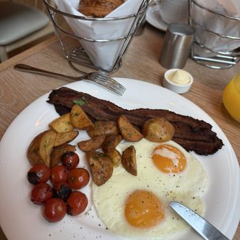 Zaytinya - Sunny side up. Love how they cooked the bacon. - Tapas/Small Plates Near Me - New York, New York Zaytinya - Sunny side up. Love how they cooked the bacon. - Tapas/Small Plates Near Me - New York, New York
