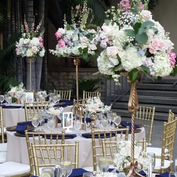 Acton Creative Flowers - Tall and short centerpieces on the tables, did double duty as the aisle decor - Florists Near Me Acton Creative Flowers - Tall and short centerpieces on the tables, did double duty as the aisle decor - Florists Near Me