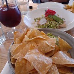Guac and chips, sangria and sweet potato tacos (at the back)