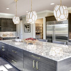 Bees Lighting - Gold and White Pendant lights over an island in a Kitchen. Find it today at from Bees Lighting