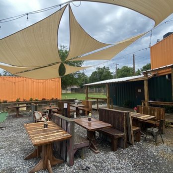 Midtown Depot - a picnic area with tables, benches, and umbrellas - Beer Gardens Near Me - Jackson, Mississippi Midtown Depot - a picnic area with tables, benches, and umbrellas - Beer Gardens Near Me - Jackson, Mississippi