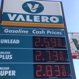 a gas price sign at a gas station a gas price sign at a gas station