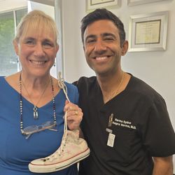 Advanced Spine Care - Kushagra Verma, MD - KM Cookie and Dr. Verma at office visit prior to surgery