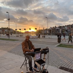 Theophilu's - A cool guy playing hip tunes at restaurant
