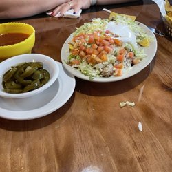 Nachos with a side of jalapeños.