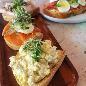 Founders Coffee - St Rose - Toast Flight w/ Egg Salad, Deluxe Lox, and Turkey. Full size Deluxe Lox in the background. - Coffee & Tea Near Me - Henderson, Nevada
