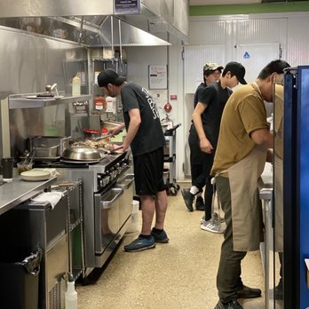 Jack's Burger Shack - a group of people in a kitchen - Burgers Near Me - Edmonton, Alberta