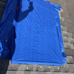 Magic Roofing & Siding - The tarp that Magic Roofing put in my roof. It was not secured properly.