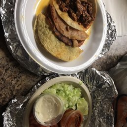 a plate of tacos and a bowl of salsa