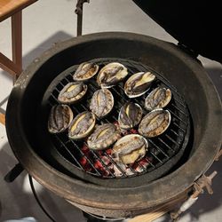Big Island Abalone - On the grill of a ceramic smoker