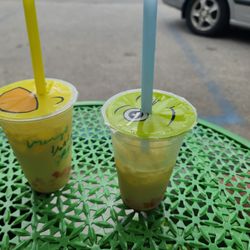 The Northern Tea House - Two boba teas. One milk tea with mango flavor and rainbow jellies. Second banana flavor tea with rainbow jellies.