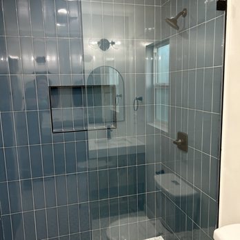 Unlimited Construction & Remodeling - a shower with a glass door - General Contractors Near Me - Beverly Hills, California Unlimited Construction & Remodeling - a shower with a glass door - General Contractors Near Me - Beverly Hills, California