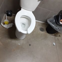 7-Eleven - Dirty bathroom toilet paper and pad wrappers