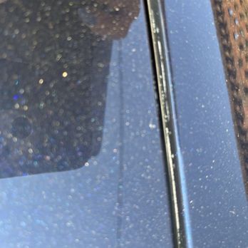 Kent’s Detailing - Photo shows either wax or compound that was left in many areas on the car. - Auto Detailing Near Me