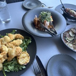 Calamari on top of arugula, ravioli nachos, zucca chips, and meatballs! Calamari on top of arugula, ravioli nachos, zucca chips, and meatballs!