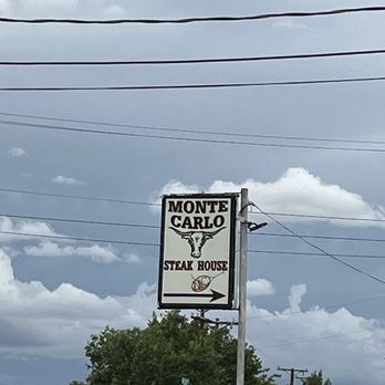 Monte Carlo Steak House - Sign on side street pointing to back of liquor store - Steakhouses Near Me - Albuquerque, New Mexico