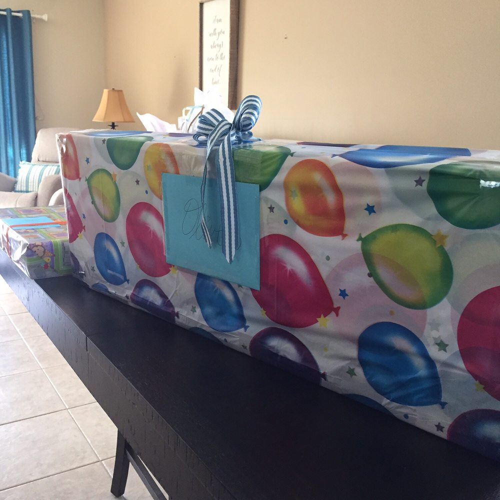 Large present wrapped with a birthday tablecloth. Card, tape, and ribbon also from Dollar Tree!! Large present wrapped with a birthday tablecloth. Card, tape, and ribbon also from Dollar Tree!!