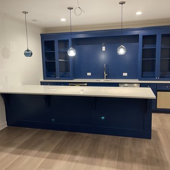 Rodrigues Flooring USA - a kitchen with blue cabinets - Flooring Near Me Rodrigues Flooring USA - a kitchen with blue cabinets - Flooring Near Me