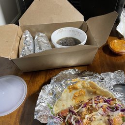 Tex Mex Fish tacos on corn tortillas. Very SMALL portion of black beans. Tex Mex Fish tacos on corn tortillas. Very SMALL portion of black beans.