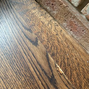 Hardwood Floors by Hall - Stain tucked up and missing stain by fireplace - Flooring Near Me - Wilmington, Illinois Hardwood Floors by Hall - Stain tucked up and missing stain by fireplace - Flooring Near Me - Wilmington, Illinois