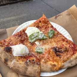 Plain slice and a Burrata slice Plain slice and a Burrata slice