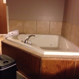 The jacuzzi tub in our room next to the bed The jacuzzi tub in our room next to the bed