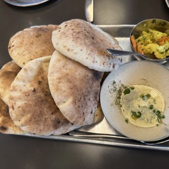 Laser Wolf - Pita and hummus - SO delicious! (Some pickles as well in the upper right) - Middle Eastern Near Me - Philadelphia, Pennsylvania