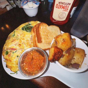 Two Chicks Cafe - Kickin' Chicken Omelet with Roasted Potatoes and Texas Toast - Breakfast & Brunch Near Me - New Orleans, Louisiana Two Chicks Cafe - Kickin' Chicken Omelet with Roasted Potatoes and Texas Toast - Breakfast & Brunch Near Me - New Orleans, Louisiana