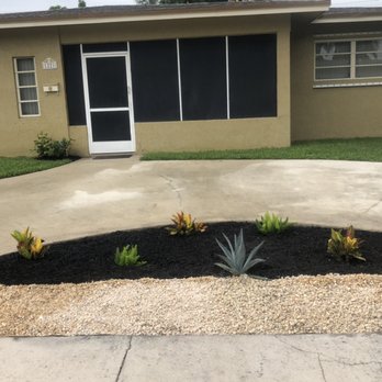 Extra Irrigations - White river stone rocks black mulch blue agrave crotons and fox tail ferns and gardenias at front door new landscaping for driveway island - Irrigation Near Me