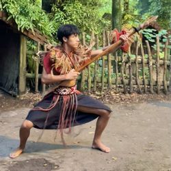 Tamaki Maori Village - A young Māori warrior demonstrates his fighting prowess