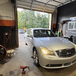 MC AutoWorkzz - Import Infiniti sedan in for service at AutoWorkzz, Collegeville. Domestic and import repair on Ridge Pike.