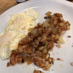 Omelette Cafe - Corned beef hash with onions and eggs over easy